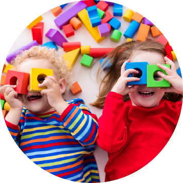 Two children playing with block toys